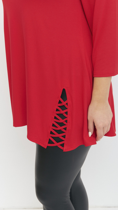 Red women's tunic decorated with a unique braid made of trimmings