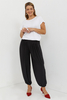 Black women's high-waist, loose trousers with pleats