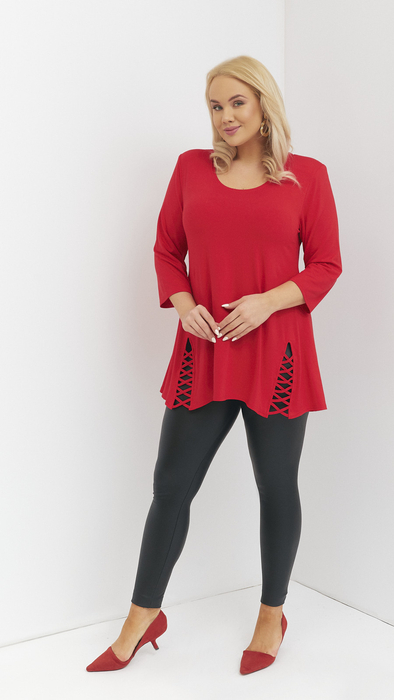 Red women's tunic decorated with a unique braid made of trimmings