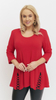 Red women's tunic decorated with a unique braid made of trimmings