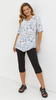 White women's tunic, loose, elegant blouse with a zipper
