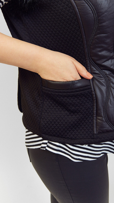 Black padded vest made of natural rabbit fur