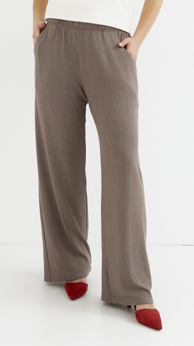 Beige women's wide, loose trousers with pockets